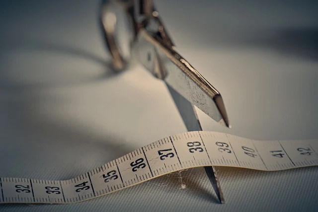 scissors cutting a measuring tape for making Medieval Gear